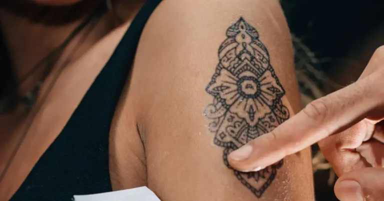 30 Spiritual Tattoos You Will Love 2024 48 spiritual tattoos: a woman gets a a tattoo.