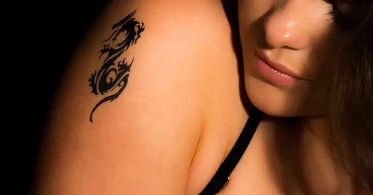 20+ Yin Yang Dragon Tattoo You Will Adore 2024 64 Yin Yang Dragon Tattoo: a woman has a Yin Yang Dragon Tattoo on her shoulder