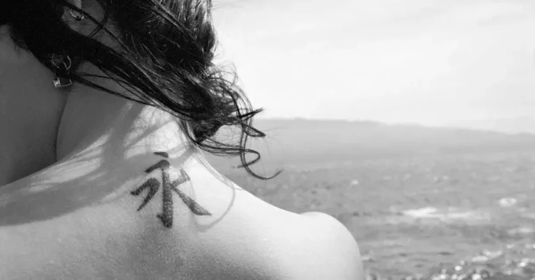 20 Spiritual Tattoos And Meanings You Need To Know 2024 1 spiritual tattoos and meanings: a woman has a tattoo on her neck