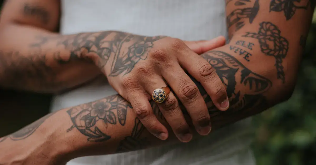 20+ Tattoos With Spiritual Meaning That Will Surprise You 2024 1 tattoos with spiritual meaning: a men shows his tattoos on his arms