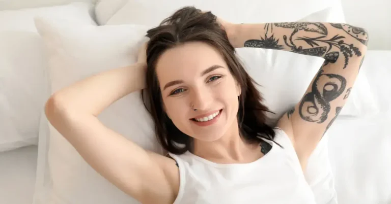 30+ Awakening Tattoo Ideas TikTok is Obsessed With 2024 45 Awakening Tattoo: a woman lie in the bed and shows her tattoo on her arm