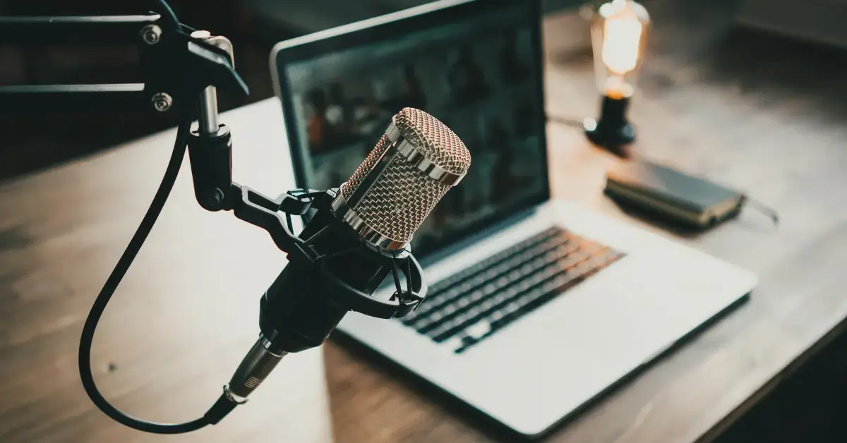 10 Best Meditation Podcast I’m in Love With 2024 1 Best Meditation Podcast: there is a microphone and a laptop