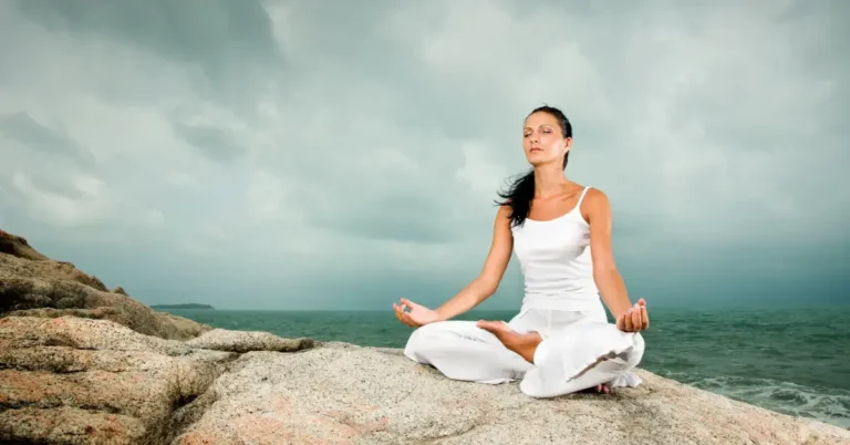 Catholic Meditation: Embracing Silence for Spiritual Growth 2024 3 Catholic Meditation: a woman sit on the beach and mediate