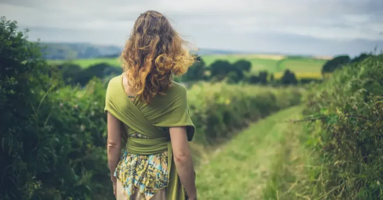 Walking Meditation: A Guide to Mindfulness on the Move 2024 5 Walking Meditation: a woman is outside and make a walk meditation