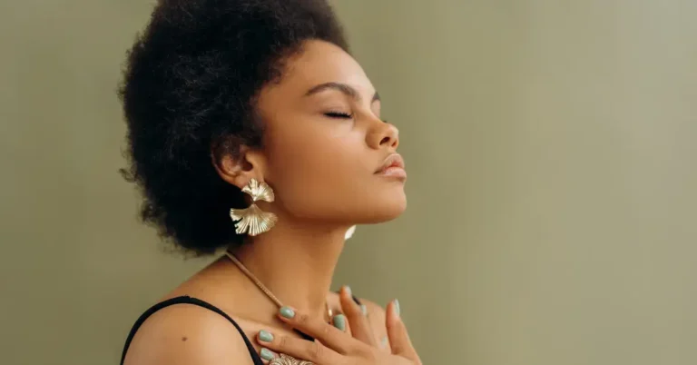 Meditation For Anxiety And Depression: Simple Techniques 2024 7 Meditation for Anxiety and Depression: a woman mediate, had her hands at her chest.