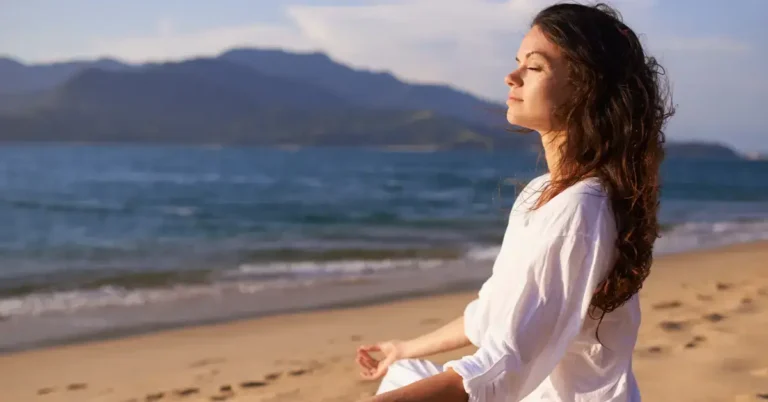 Meditation For Inner Peace And Happiness: Your Guide 2024 5 Meditation for Inner Peace and Happiness: a woman is sitting on the beach and mediate.