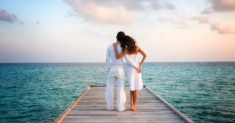20+ Spiritual Aesthetic Art Love: My Personal Favorites 2024 43 Spiritual Aesthetic Art Love: a couple stay on a bridge at the beach and stay in arms.
