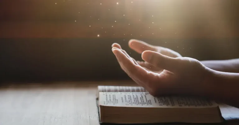 How To Be Spiritual Without Religion: Simple Practices 2024 7 How To Be Spiritual Without Religion: A serene forest with sunlight filtering through the trees, a flowing stream, and a lone figure meditating in the midst of nature