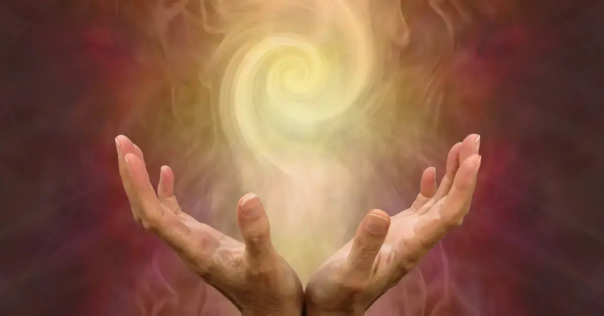 White Aura: Discovering Its Meaning And Benefits 2024 1 White Aura: two hands hold yellow energy